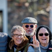 Group of people doing anchor up hand sign on campus tour